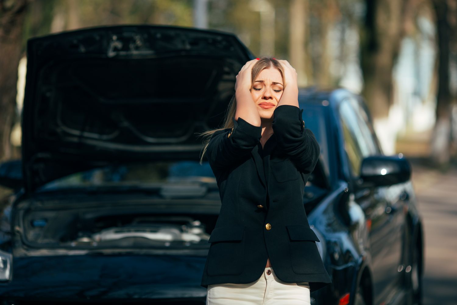 woman distressed with broken car
